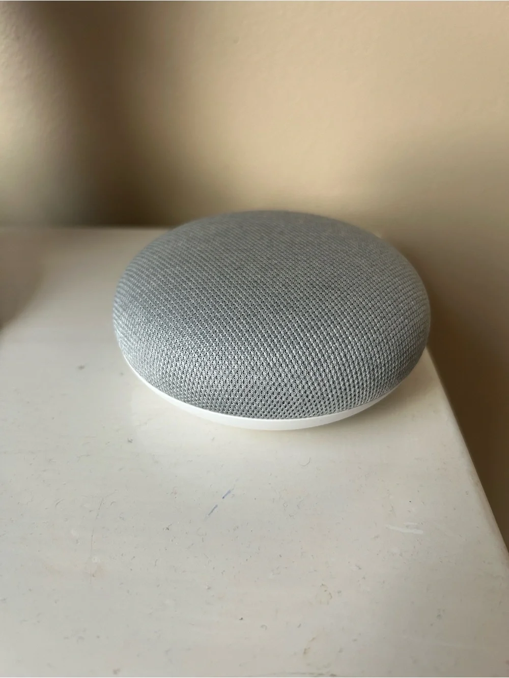 Google Nest Mini Smart Speaker in Light Gray and White